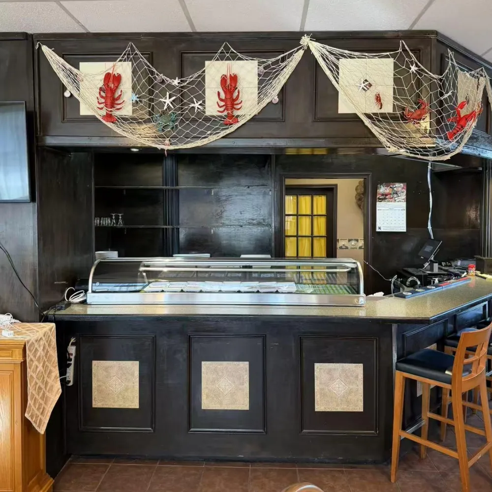 Restaurant counter with seafood decor at Eraka Sushi, a Japanese Restaurant in Easton