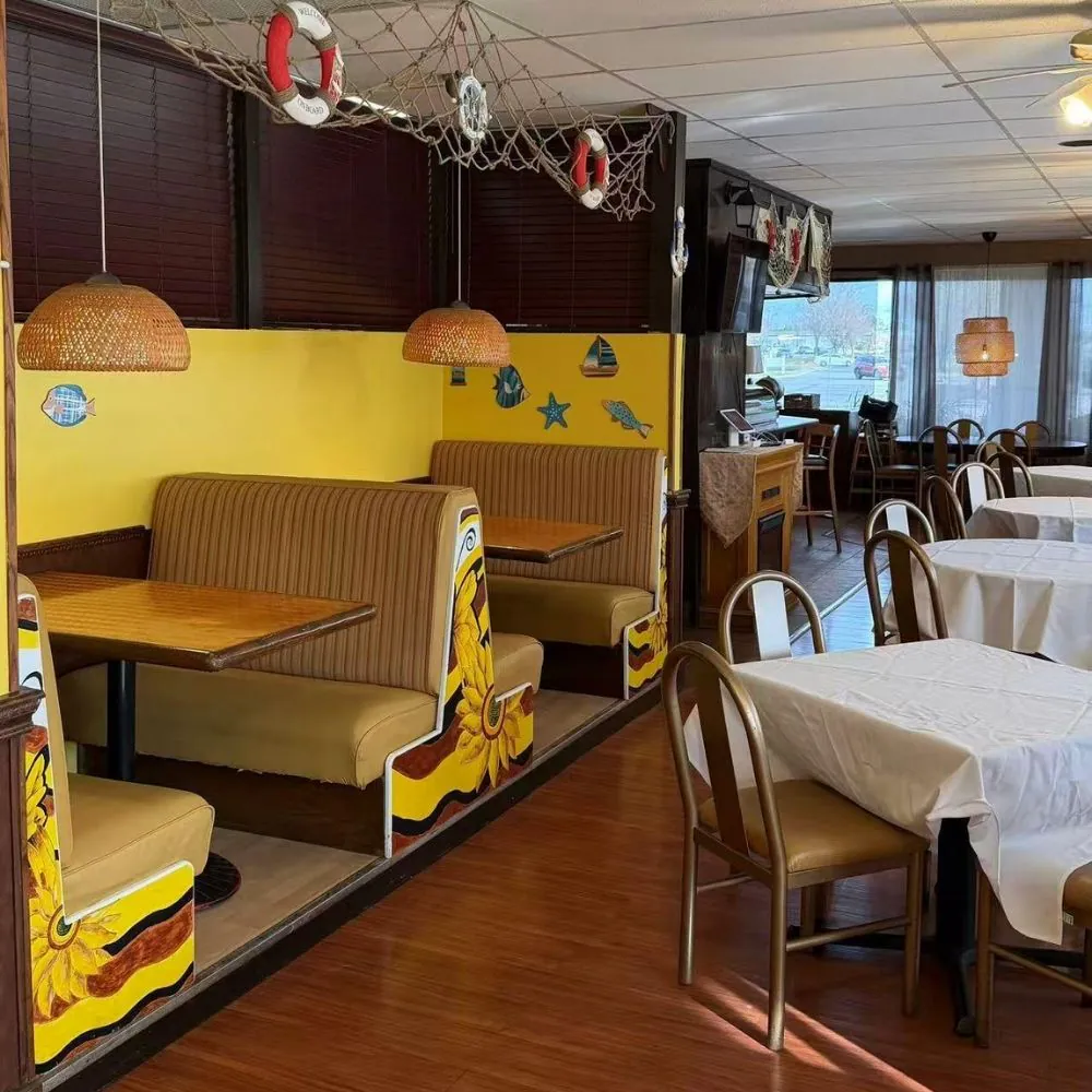 Cozy booths with sunflower decor and nautical accents at Eraka Sushi, a Japanese Restaurant in Easton